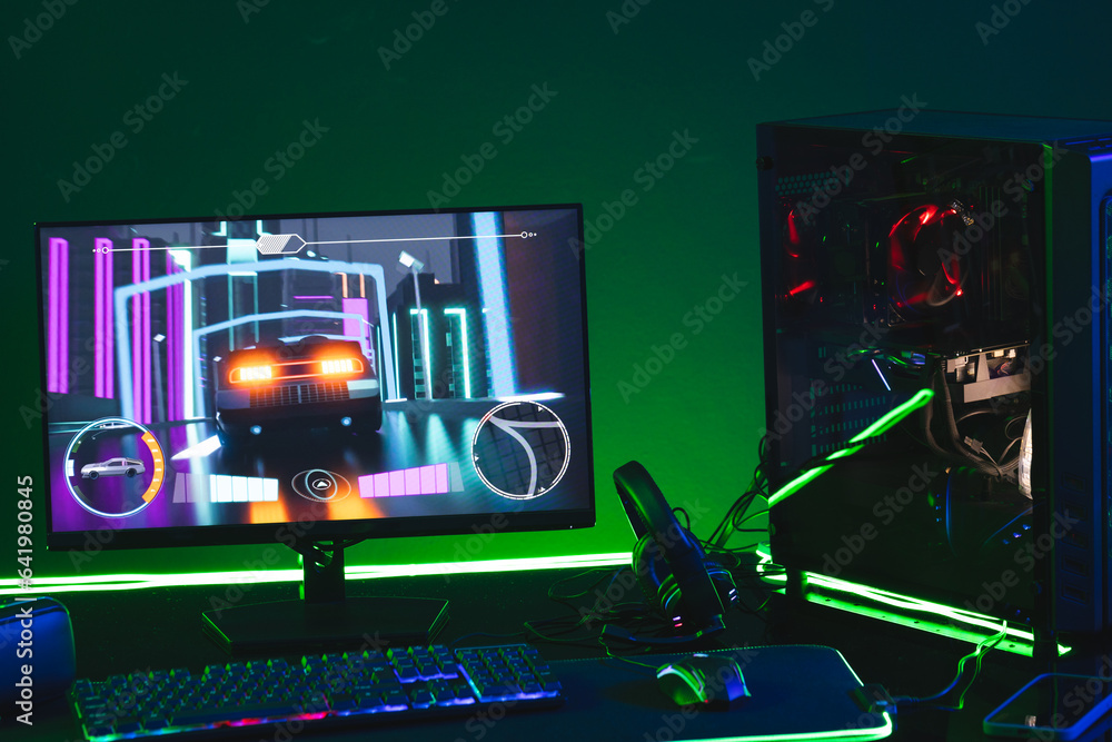 Poster composite of computer, keyboard with video game accessories with copy space on neon background