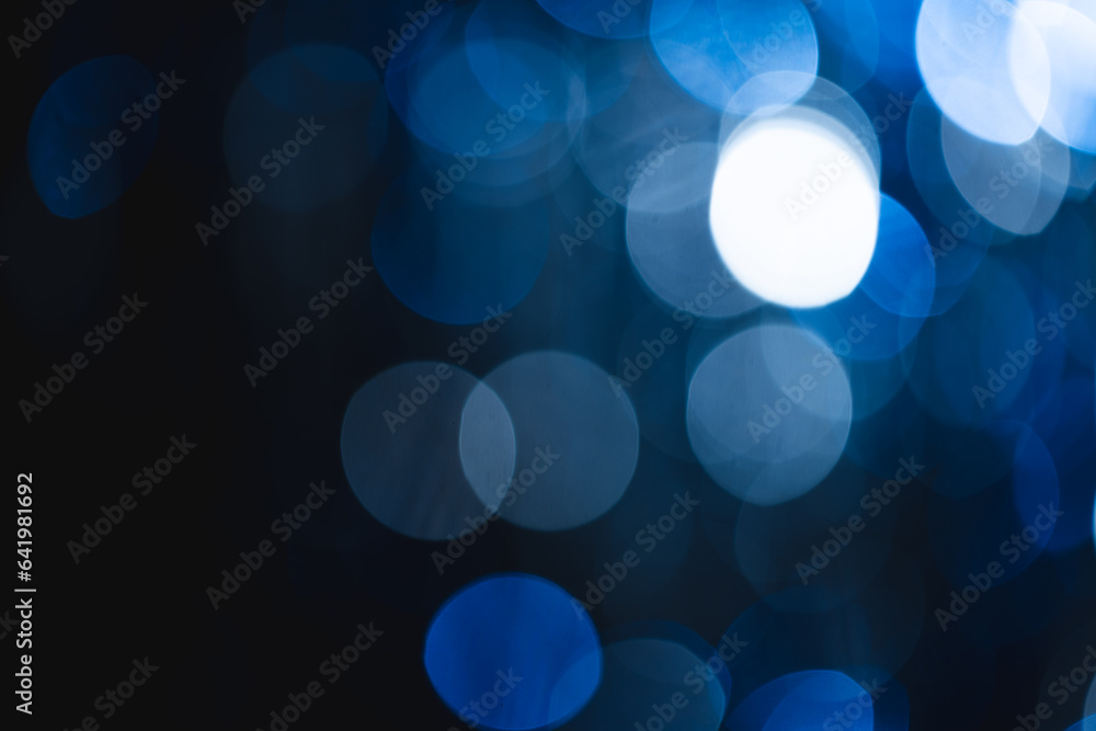 Aufkleber blue bokeh lights with copy space on dark background