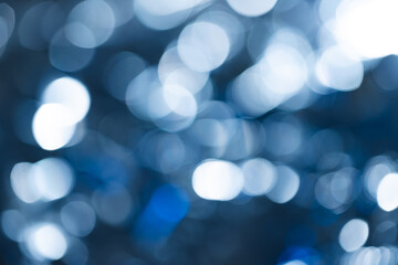 Blue bokeh lights with copy space on dark background