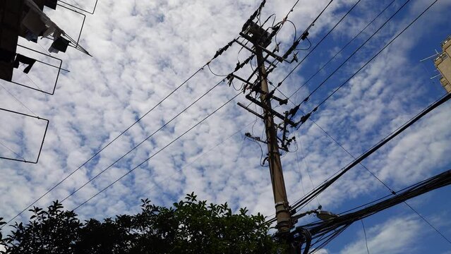 Street view of Shanghai with old electricity cable pole.