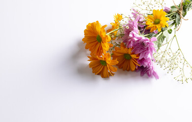 Bunch of pink and yellow flowers with copy space on white background
