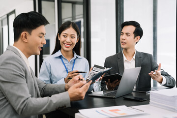 Co working team meeting concept: Businessman working and studying together with tablet document graph paper in office, discuss finance and marketing solution reporting file in working place.