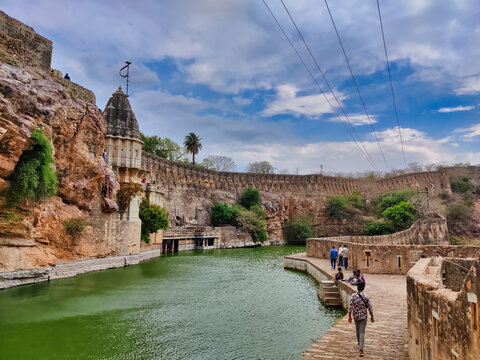 Picture of Gaumukh Kund at Chittorgarh Fort shot during daylight against white clouds and blue sky