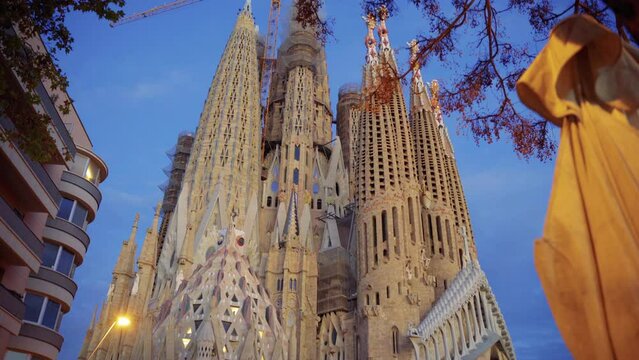 view of the sagrada familia from one of the side streets, barcelona, ​​spain