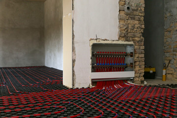 Main control manifold of house heating system, work in progress on construction site for a flat...