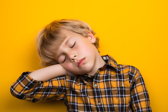 Studio portrait of a little boy being tired and sleepy, isolated on colorful background. Kids emotions or moods concept. Generative AI