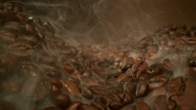 Super Slow Motion Slider Shot of Roasting Coffee Beans and Smoke at 1000 fps.