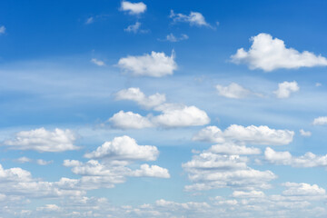 Cumulus clouds in blue sky, white fluffy clouds floating in blue sky, blue sky background with clouds