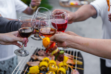 Happy family having fun outdoor. Group of family having backyard dinner party bbq together.cheers barbecue party