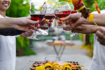 Happy family having fun outdoor. Group of family having backyard dinner party bbq together.cheers barbecue party