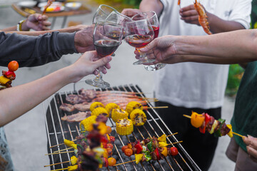 Happy family having fun outdoor. Group of family having backyard dinner party bbq together.cheers barbecue party