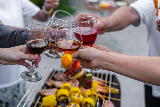Happy family having fun outdoor. Group of family having backyard dinner party bbq together.cheers barbecue party