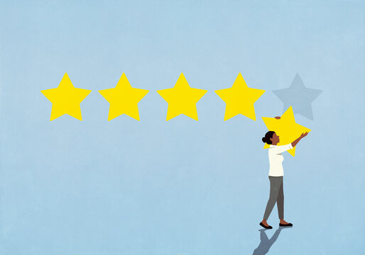 Woman removing rating star from blue background
