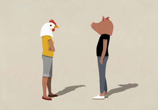 Confrontational couple in pig and chicken heads standing face to face
