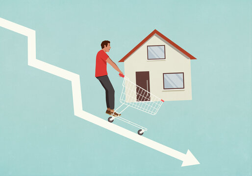 Man with house in shopping cart falling on descending arrow
