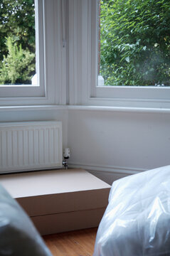 Close up of empty room with boxes and packages
