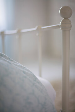 Close up of bed and white bed frame
