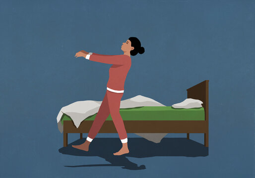Woman in pajamas sleepwalking along bed in nighttime bedroom
