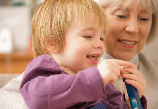 Grandmother and grandchild smiling
