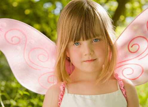 Close up of  girl in a pink fairy costume
