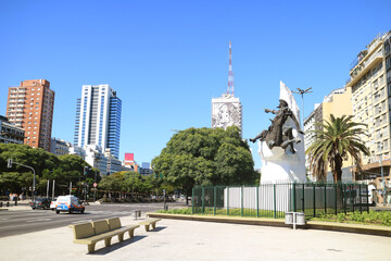 Fototapeta na wymiar Avenida 9 de Julio Avenue of Buenos Aires with Impressive Building of the Ministry of Health and Public Works Depicting an Image of Eva Peron on its Facade, Argentina, South America
