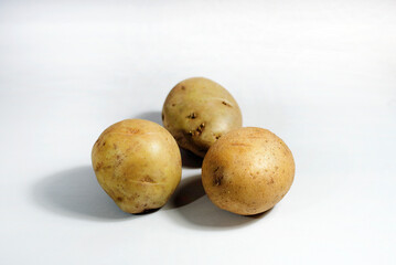 Three fresh potatoes