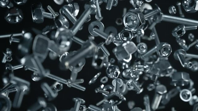 Super Slow Motion Shot of Fasteners Explosion Towards Camera Isolated on Black at 1000fps.