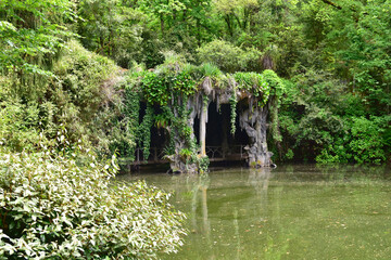 Cave with a lake in the front