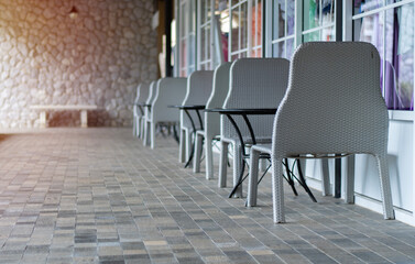 Gray Metal Table, ceramic table face with chairs outdoor in the home garden.