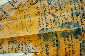 old letters with ink stains and unintelligible writing