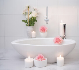 Fototapeta na wymiar Romantic Zen Retreat: Elegant White Bathroom with Modern Vessel Sink, Roses, and Candlelit Ambiance for a Relaxing and Luxurious Experience