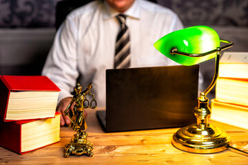 office of a lawyer with statue of Lady Justice, goddess Justitia, on the desk - obrazy, fototapety, plakaty