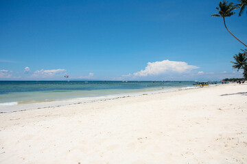Beautiful beach with blue waters, white sand and clear sky at Alona Beach, Bohol, Philippines.