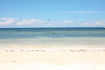 Fototapeta na wymiar Beautiful beach with blue waters, white sand and clear sky at Alona Beach, Bohol, Philippines.