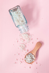 Mineral-rich sea coarse salt on a pink background. Salt harvested in the marshes of the Île de Ré in France