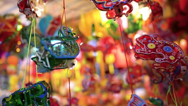 Decorated colorful lanterns hanging on a stand in the streets in Ho Chi Minh City, Vietnam during Mid Autumn Festival.