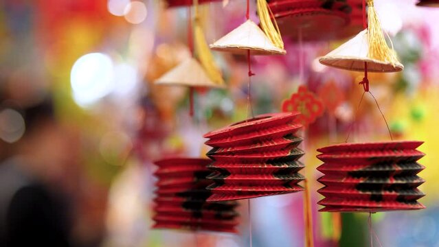 Decorated colorful lanterns hanging on a stand in the streets in Ho Chi Minh City, Vietnam during Mid Autumn Festival.
