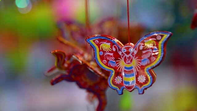 Decorated colorful lanterns hanging on a stand in the streets in Ho Chi Minh City, Vietnam during Mid Autumn Festival.