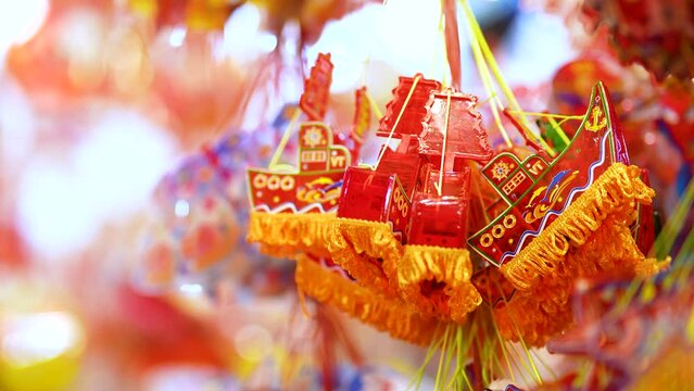 Decorated colorful lanterns hanging on a stand in the streets in Ho Chi Minh City, Vietnam during Mid Autumn Festival.