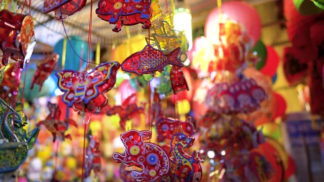 Decorated colorful lanterns hanging on a stand in the streets in Ho Chi Minh City, Vietnam during Mid Autumn Festival.