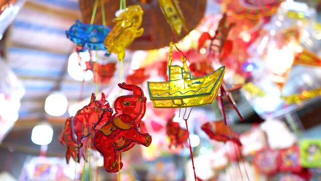 Decorated colorful lanterns hanging on a stand in the streets in Ho Chi Minh City, Vietnam during Mid Autumn Festival.