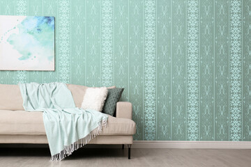 Comfortable sofa near wall. Minimalist living room interior