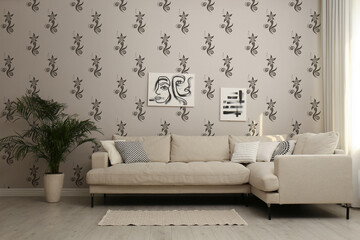 Cozy living room interior with comfortable big sofa and houseplant