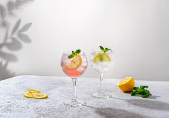 Gin tonic classic alcoholic cocktail drink with dry gin. Alcohol drink with lemon. Gin tonic cocktail with lemon. - obrazy, fototapety, plakaty