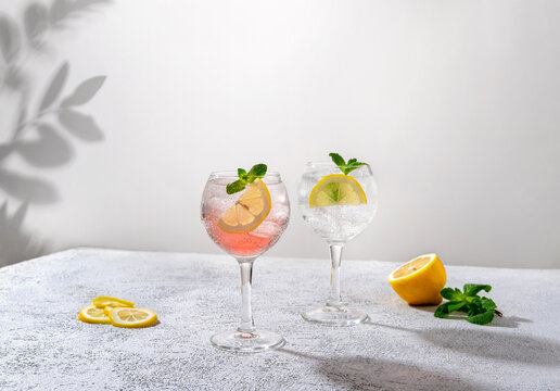 Gin tonic classic alcoholic cocktail drink with dry gin. Alcohol drink with lemon. Gin tonic cocktail with lemon.