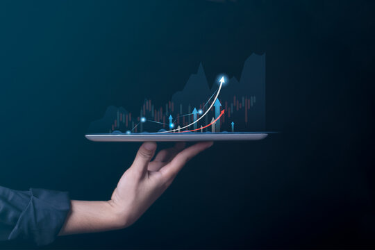 Business economic show growth graph on screen tablet concept digital technology stock market  strategy arrow data upward.