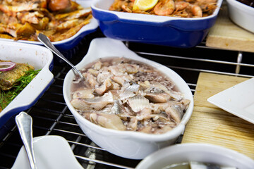 Pickled herring dishes served buffet lunch. Healthy seafood dinner restaurant buffet menu