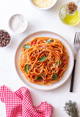 Spaghetti pasta with tomato sauce, basil and Parmesan cheese. Italian cuisine. Vegetarian food.