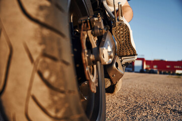 Close up view of modern motorcycle that is parked outdoors