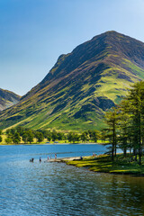 Bathers enjoying hot sumer weather at Buttermere in the English Lake District